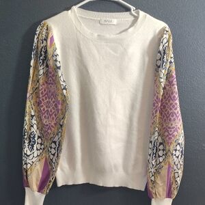 Avara Elegant Cream Sweater with Vibrant Cotton Sleeves.